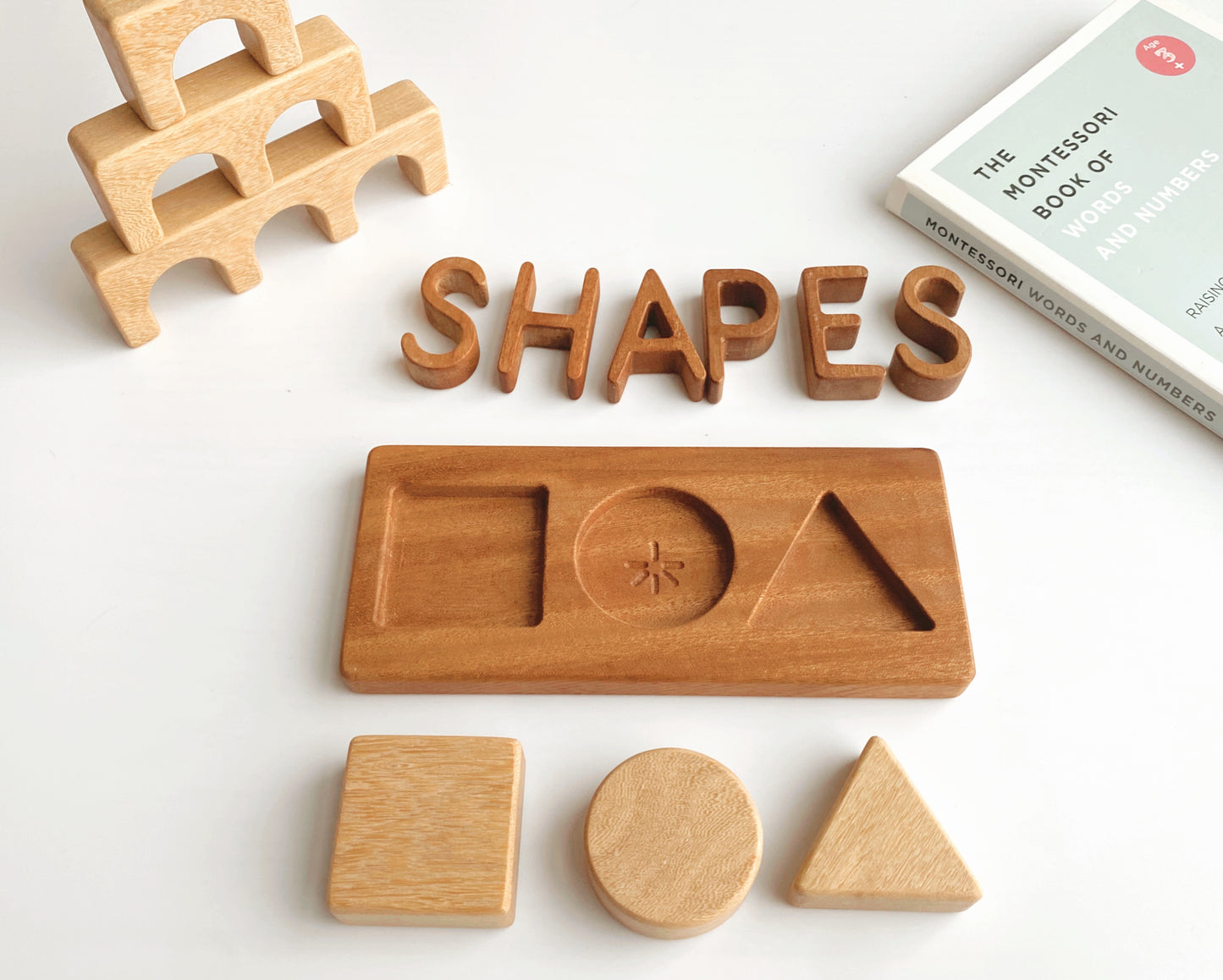 Square, Circle, Triangle. The shapes puzzle enables the little ones to develop hand-eye coordination and visual perception skills. Each chunky shape is made from Tembusu wood allowing the tiniest hands to grasp and the board is made from African Mahogany (Khaya).