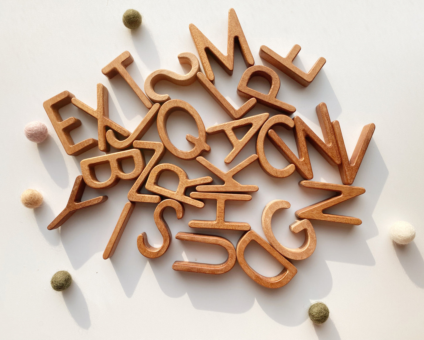 A, B, C, D, E. A staple in the nursery of every budding spelling bee. This set of montessori-inspired moveable alphabets enable the littlest hands to spell and for phonetic play.